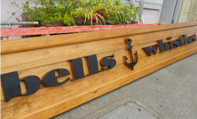 “Bells and Whistles” Sign